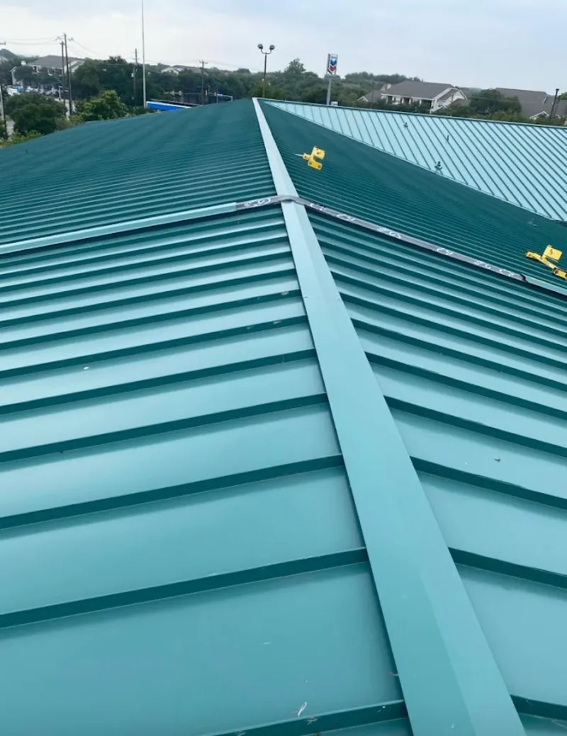 Green commercial metal roof ridge and valley for Metal Roof Repair in West Perrine